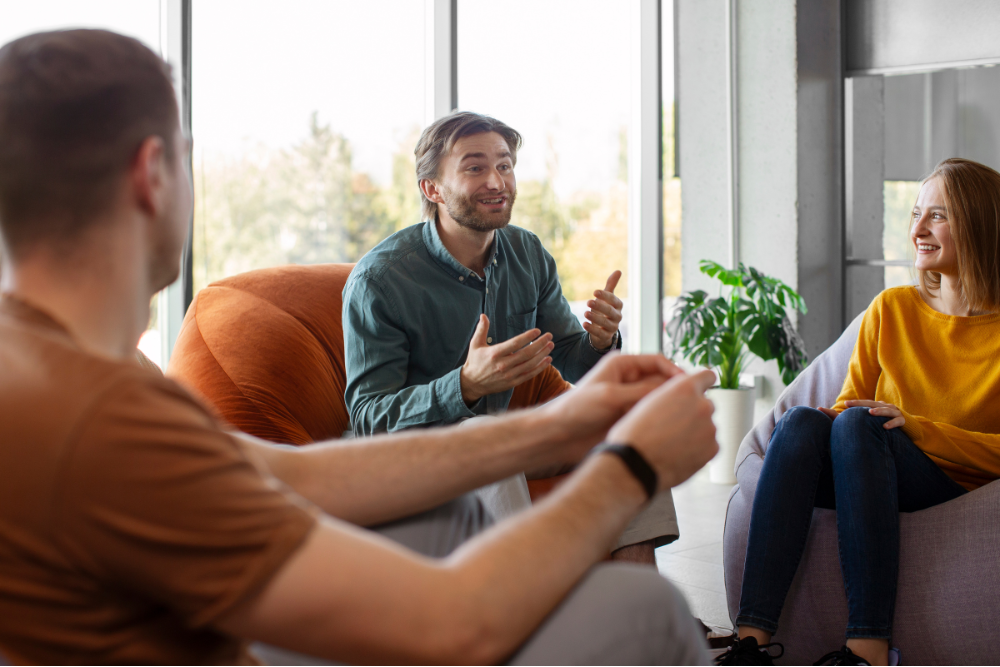 Patients engaging in a group therapy discussion at a psychiatry clinic in New Windsor, NY, receiving expert mental health treatment for various conditions.